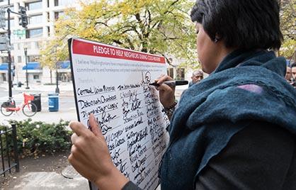 Mayor Bowser signs the hypothermia pledge